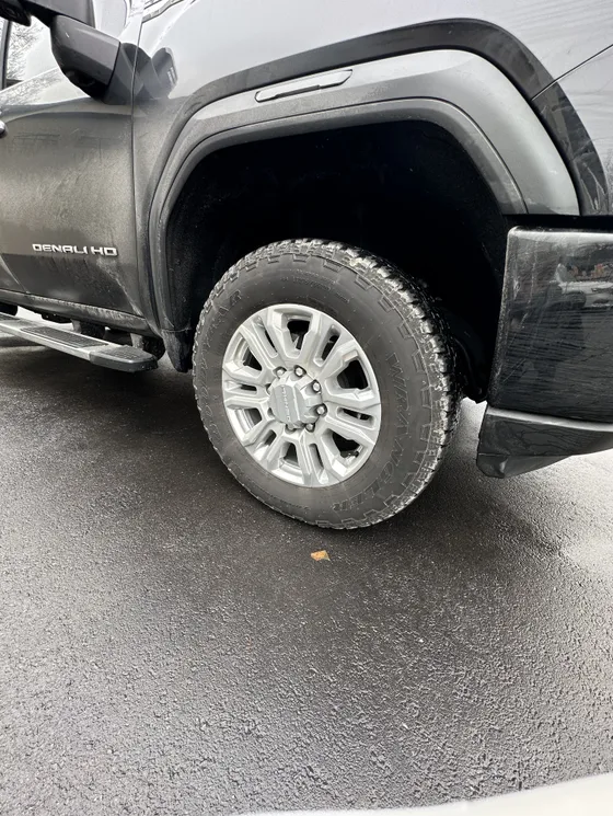 Cleaned wheel and arch on a GMC Sierra Denali HD
